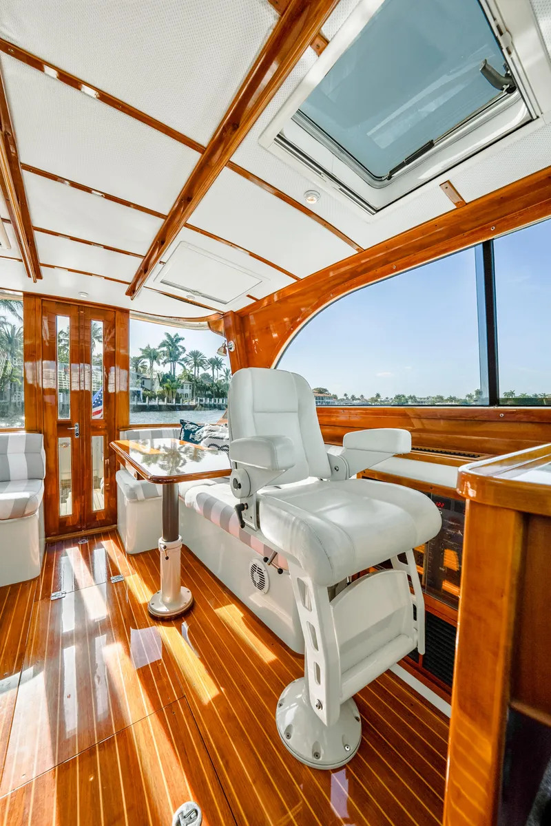Slide: The Image of Luxurious interior of 2008 Hinckley Talaria 44 yacht with polished wood and white seating. - 6