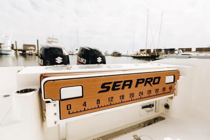 Slide: The Image of 2019 Sea Pro 259 Center Console boat with Suzuki engines at marina. - 10