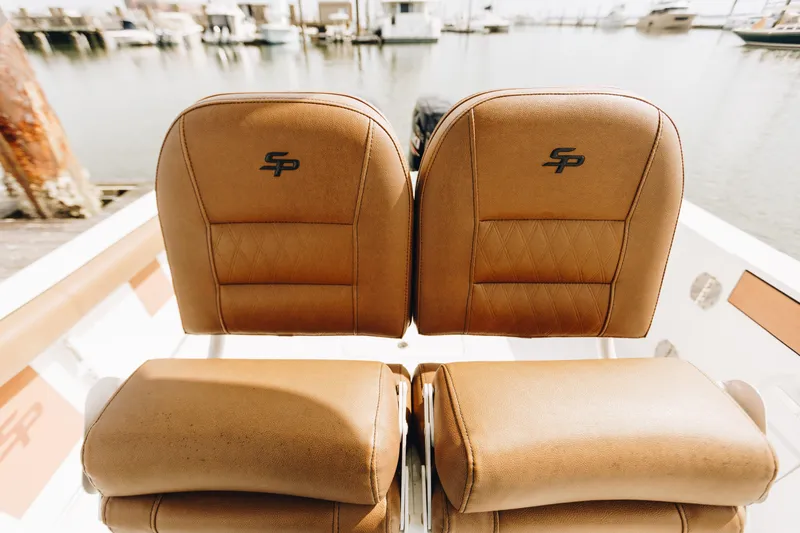 Slide: The Image of Brown leather seats on a 2019 Sea Pro 259 Center Console boat. - 9