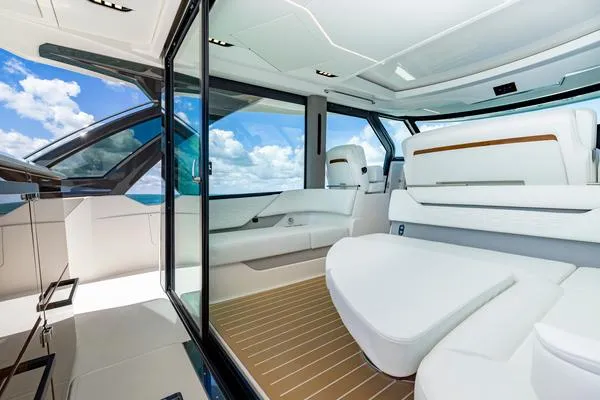 Slide: The Image of Luxurious interior of 2025 Tiara Yachts 56 LS with modern seating and ocean view. - 10
