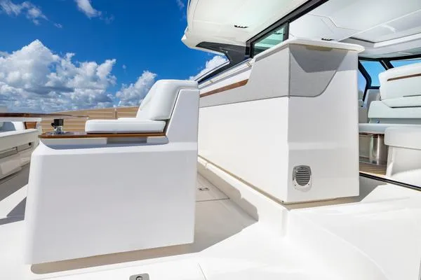 Slide: The Image of 2025 Tiara Yachts 56 LS luxury yacht interior with sleek seating and modern design. - 14