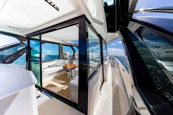 Slide: The Image of 2025 Tiara Yachts 56 LS luxury yacht interior with ocean view and modern design. - 8