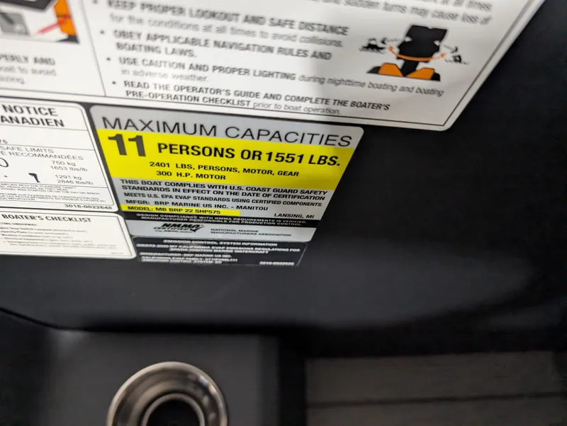 Slide: The Image of Manitou Explore 2025 capacity label: 11 persons or 1551 lbs maximum load. - 10