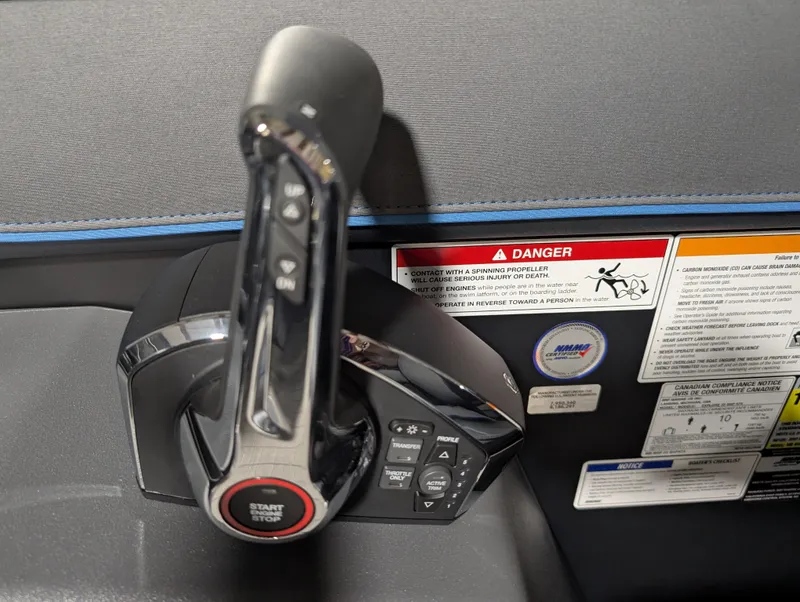 Slide: The Image of Control panel of 2025 Manitou Explore with start/stop button and warning labels. - 11