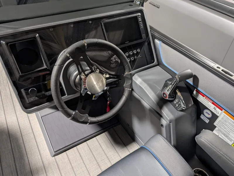 Slide: The Image of 2025 Manitou Explore dashboard with steering wheel and control panel. - 9