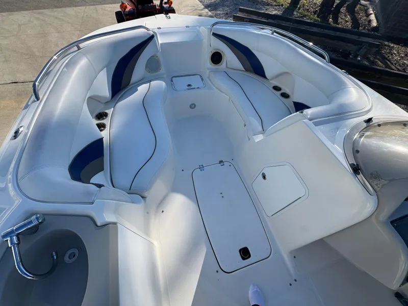 Slide: The Image of 2012 Hurricane SunDeck Sport 200 OB boat interior with white and blue seating. - 12