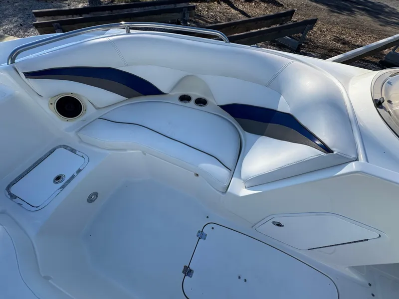 Slide: The Image of 2012 Hurricane SunDeck Sport 200 OB boat interior with white and blue seating. - 8