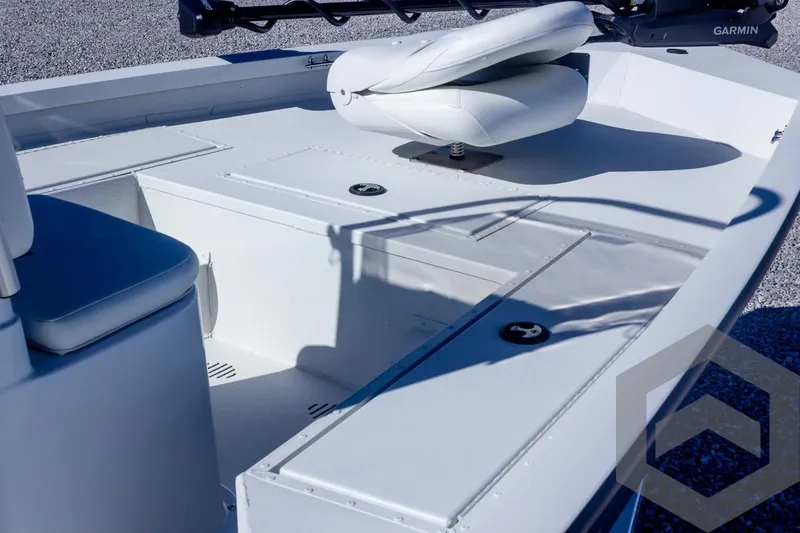 Slide: The Image of 2025 G3 Bay 19 GX boat interior with seating and storage compartments. - 14