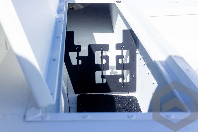 Slide: The Image of Open storage compartment in 2025 G3 Bay 19 GX boat. - 19