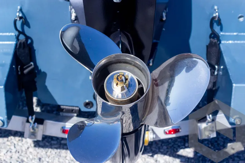 Slide: The Image of Close-up of a G3 Bay 19 GX 2025 boat propeller, shiny metal blades. - 25