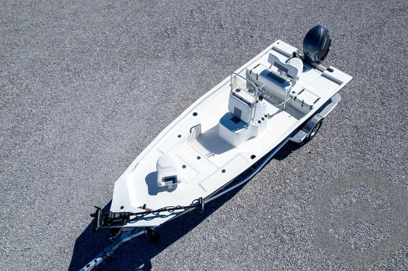 Slide: The Image of 2025 G3 Bay 19 GX boat on trailer, aerial view, parked on gravel surface. - 31