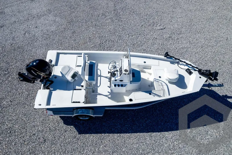 Slide: The Image of 2025 G3 Bay 19 GX boat on gravel, featuring modern design and equipment. - 35