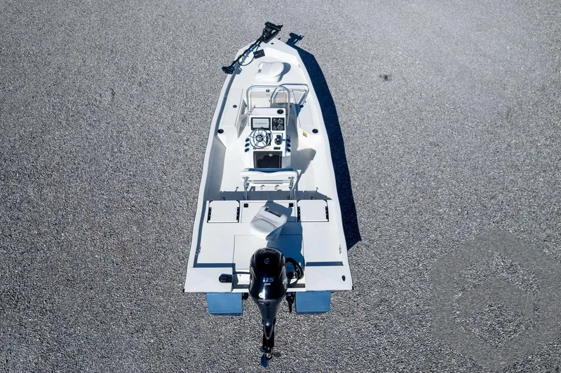Slide: The Image of 2025 G3 Bay 19 GX boat, aerial view, on gravel surface. - 37
