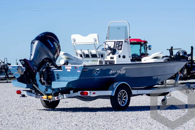 Slide: The Image of 2025 G3 Bay 19 GX boat on trailer, featuring sleek design and powerful outboard motor. - 5