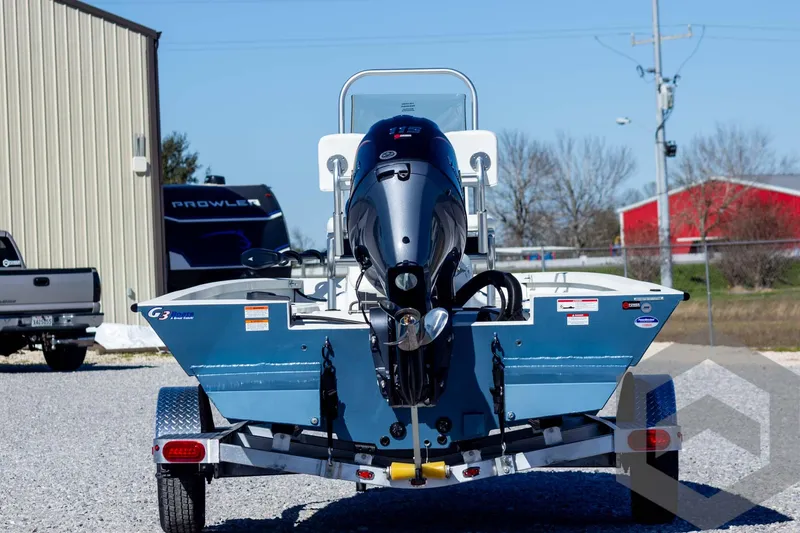 Slide: The Image of 2025 G3 Bay 19 GX boat on trailer, rear view, outdoors. - 6
