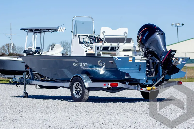 Slide: The Image of 2025 G3 Bay 19 GX boat on trailer, featuring sleek design and powerful outboard motor. - 7