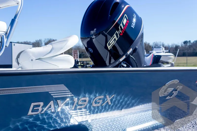 Slide: The Image of 2025 G3 Bay 19 GX boat with Yamaha engine, reflecting sunlight on water. - 9