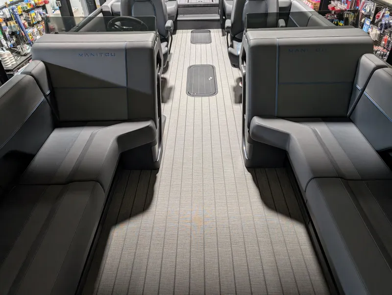 Slide: The Image of 2025 Manitou Explore Dual Engine interior with sleek seating and modern design. - 13