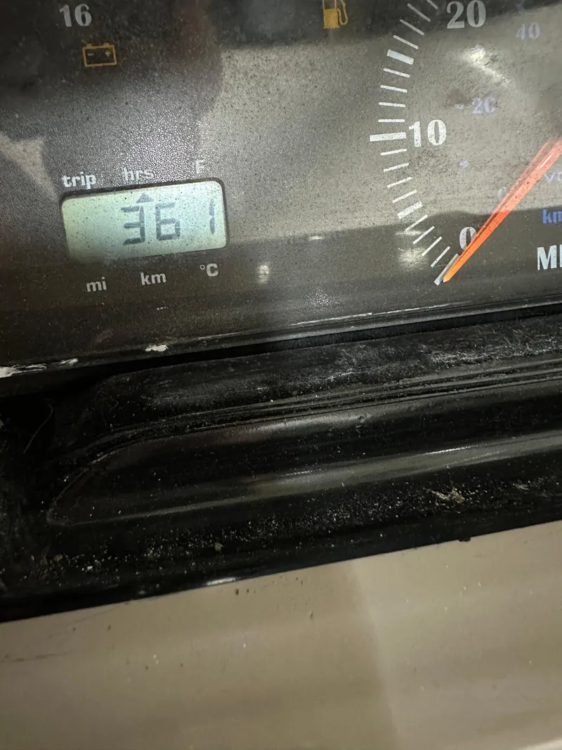 Slide: The Image of Close-up of a 2001 Regal 2350 LSC dashboard showing 361 miles on trip meter. - 15