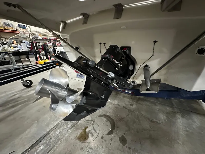Slide: The Image of 2001 Regal 2350 LSC boat stern with propeller in a workshop setting. - 4