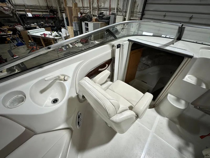 Slide: The Image of 2001 Regal 2350 LSC boat interior with seating and cabin entrance. - 7