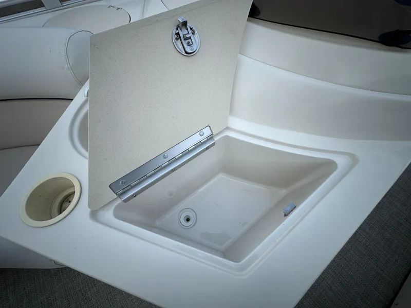 Slide: The Image of Open storage compartment on 2003 Harris FloteBote 260 Royal Heritage boat. - 10