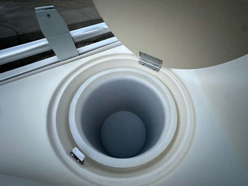 Slide: The Image of Open storage compartment on 2003 Harris FloteBote 260 Royal Heritage boat. - 11