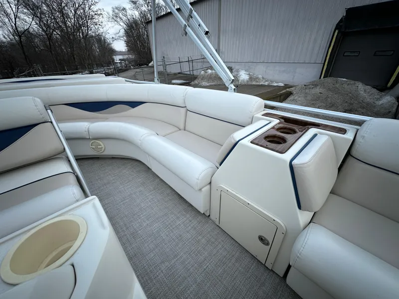 Slide: The Image of 2003 Harris FloteBote 260 Royal Heritage interior with plush seating and cup holders. - 12