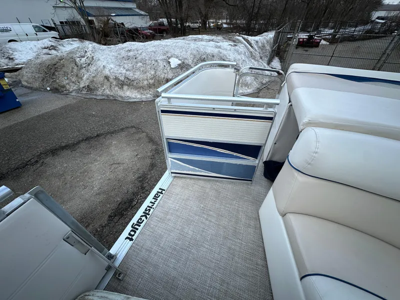 Slide: The Image of 2003 Harris FloteBote 260 Royal Heritage pontoon boat interior with blue and white seating. - 18