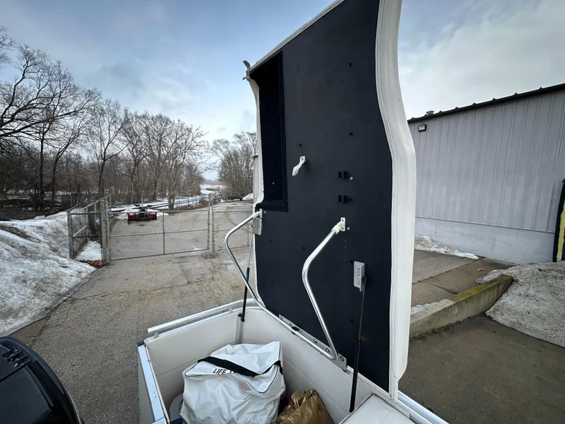 Slide: The Image of Open storage compartment of 2003 Harris FloteBote 260 Royal Heritage boat. - 3