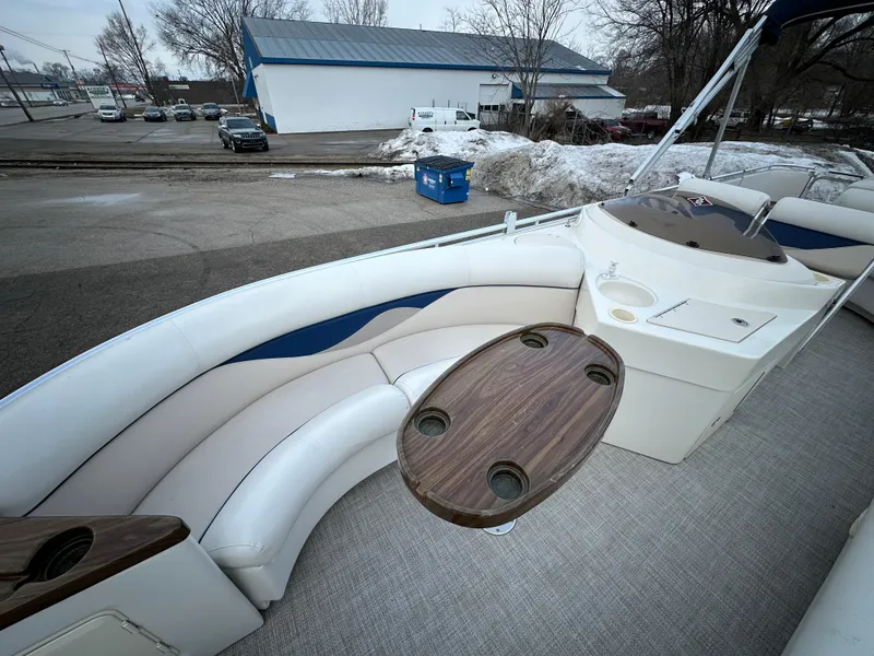 Slide: The Image of 2003 Harris FloteBote 260 Royal Heritage pontoon boat interior with seating and table. - 8