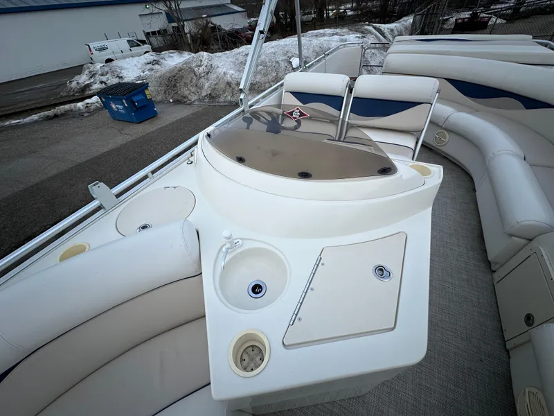 Slide: The Image of 2003 Harris FloteBote 260 Royal Heritage boat interior with seating and control panel. - 9