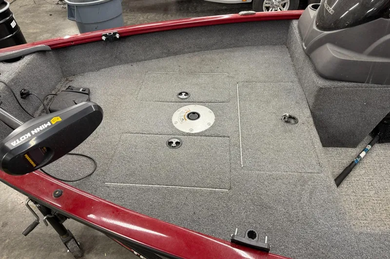 Slide: The Image of 2022 Tracker Super Guide V 16 SC boat interior with Minn Kota trolling motor. - 3