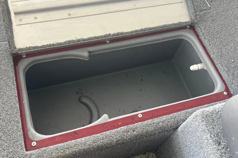 Slide: The Image of Open storage compartment in 2022 Tracker Super Guide V 16 SC boat. - 8