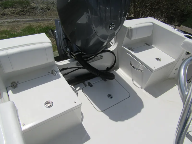 Slide: The Image of 2025 Parker 18SE Center Console boat interior with seating and storage compartments. - 10