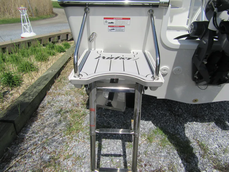 Slide: The Image of 2025 Parker 18SE Center Console boat with swim platform and ladder. - 12