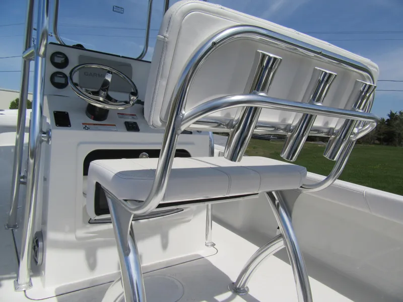 Slide: The Image of 2025 Parker 18SE Center Console boat interior with steering wheel and rod holders. - 4