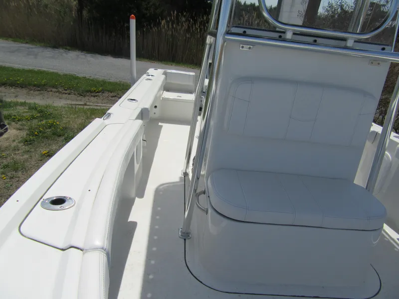 Slide: The Image of 2025 Parker 18SE Center Console boat interior with seating and console view. - 7