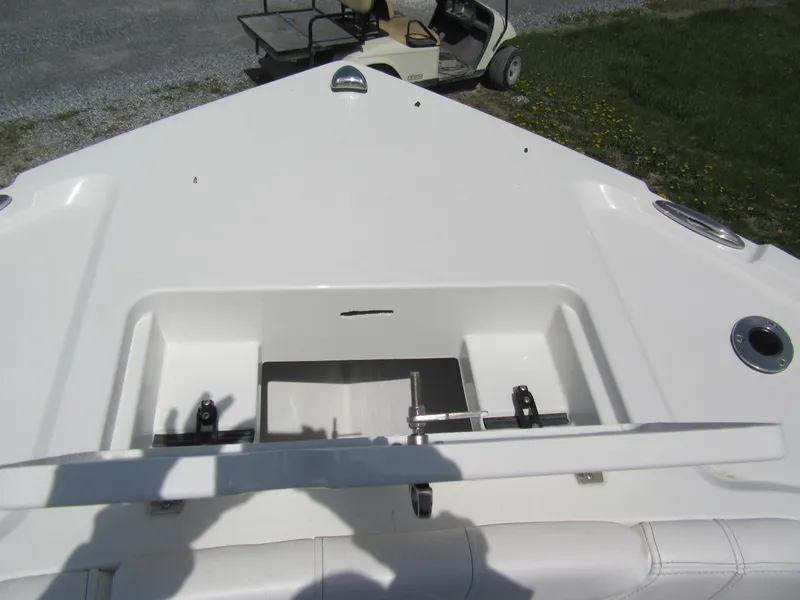 Slide: The Image of 2025 Parker 18SE Center Console boat deck with open storage compartment. - 8