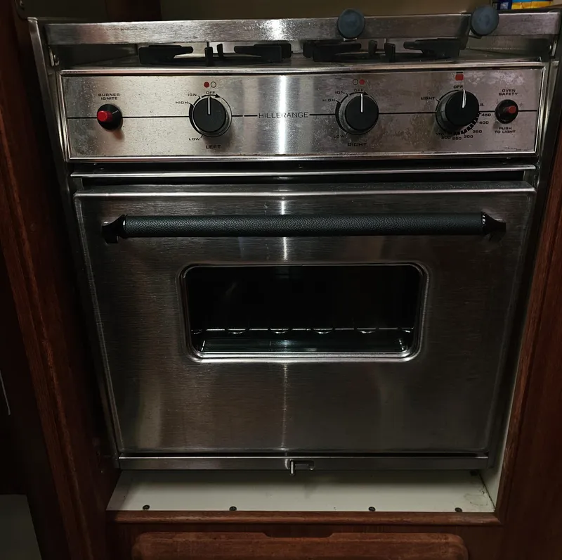 Slide: The Image of Stainless steel marine oven, Hunter 336, 1995 model, with control knobs and handle. - 14