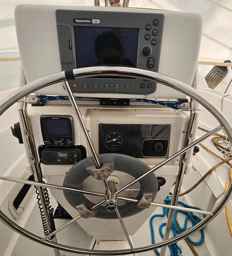 Slide: The Image of Steering wheel and navigation equipment on a 1995 Hunter 336 sailboat. - 23