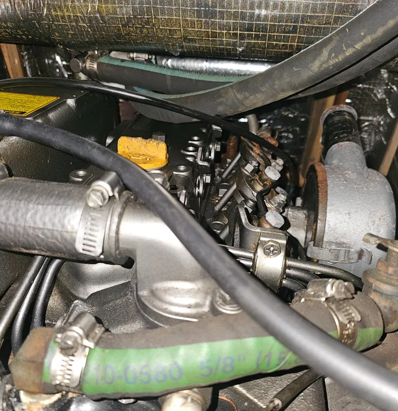 Slide: The Image of Close-up of a 1995 Hunter 336 engine components and hoses. - 25