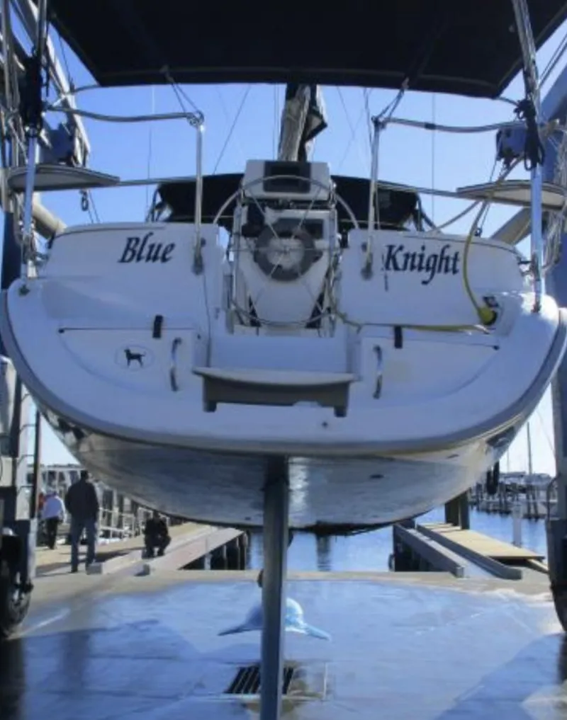 Slide: The Image of Hunter 336 sailboat "Blue Knight" on lift, 1995 model, dockside view. - 27