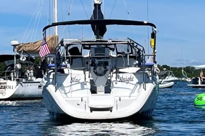Slide: The Image of Sailboat "Blue Knight" on water, Hunter 336, 1995 model, with American flag. - 3