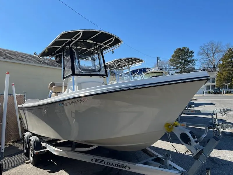 Slide: The Image of 2016 Parker 2100 Special Edition boat on EZ Loader trailer, parked outdoors. - 1