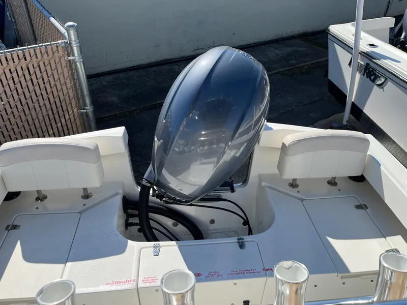 Slide: The Image of 2016 Parker 2100 Special Edition boat with outboard motor, viewed from the rear deck. - 2
