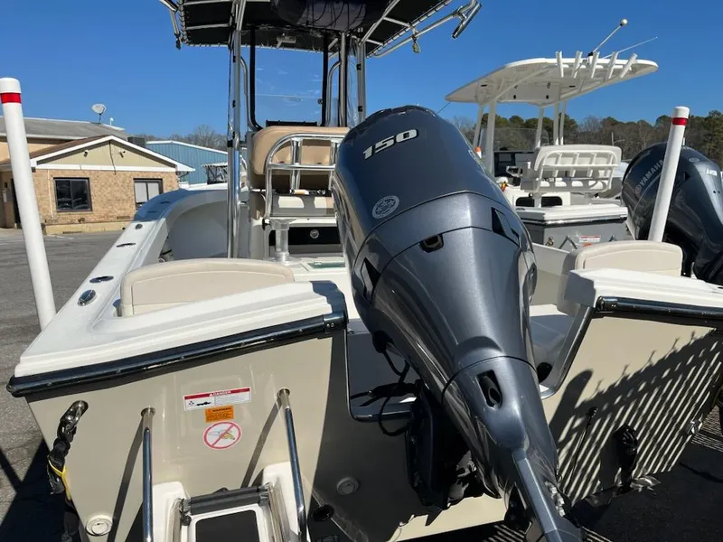 Slide: The Image of Parker 2100 Special Edition 2016 boat with 150 HP outboard motor, docked outdoors. - 5