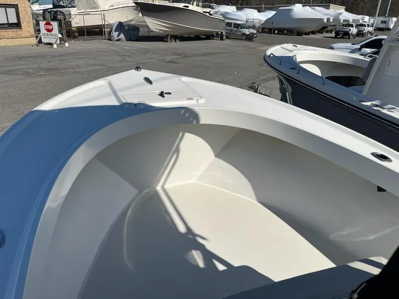 Slide: The Image of Parker 2100 Special Edition boat, 2016 model, docked with other vessels in a marina. - 7