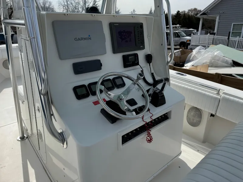 Slide: The Image of Center console of 2010 Contender 25 Open boat with Garmin navigation system. - 6