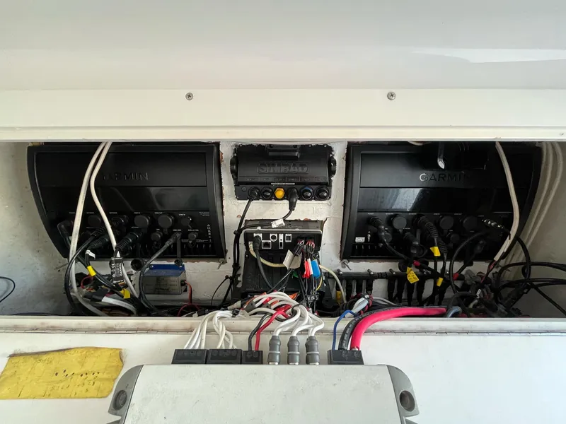 Slide: The Image of Electrical panel of 2021 Invincible 39 Open Fisherman with Garmin equipment and wiring. - 12